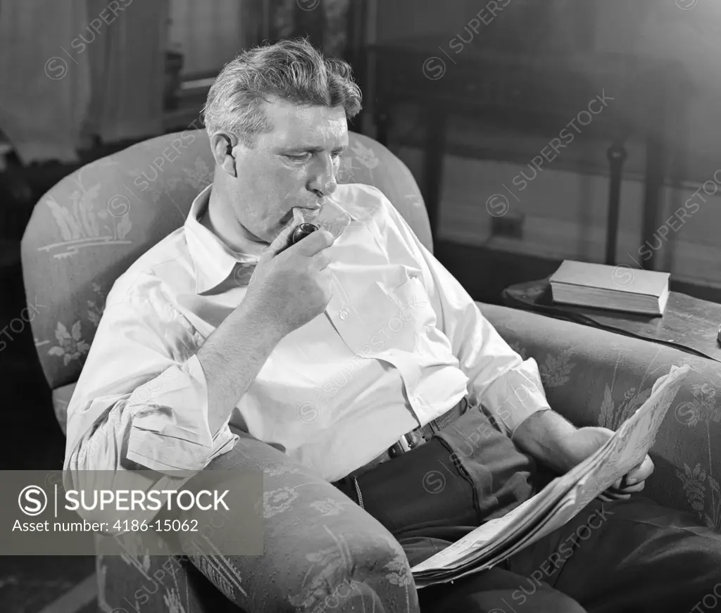 1930S Man Sitting Chair Reading Newspaper Smoking Pipe