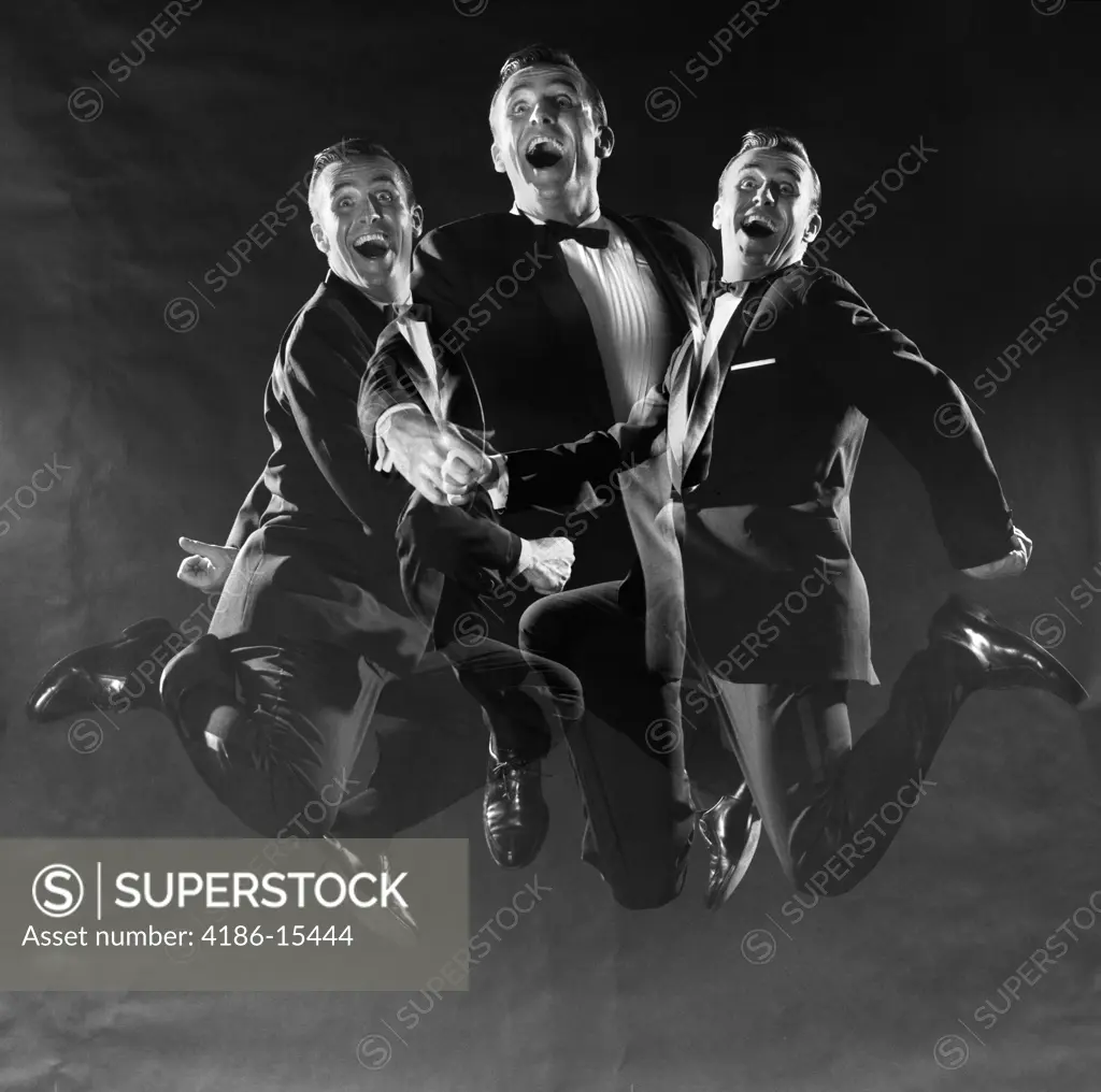 1950S 1960S Graphic Effect Triple Exposure Man In Dinner Jacket Jumping Up And Down