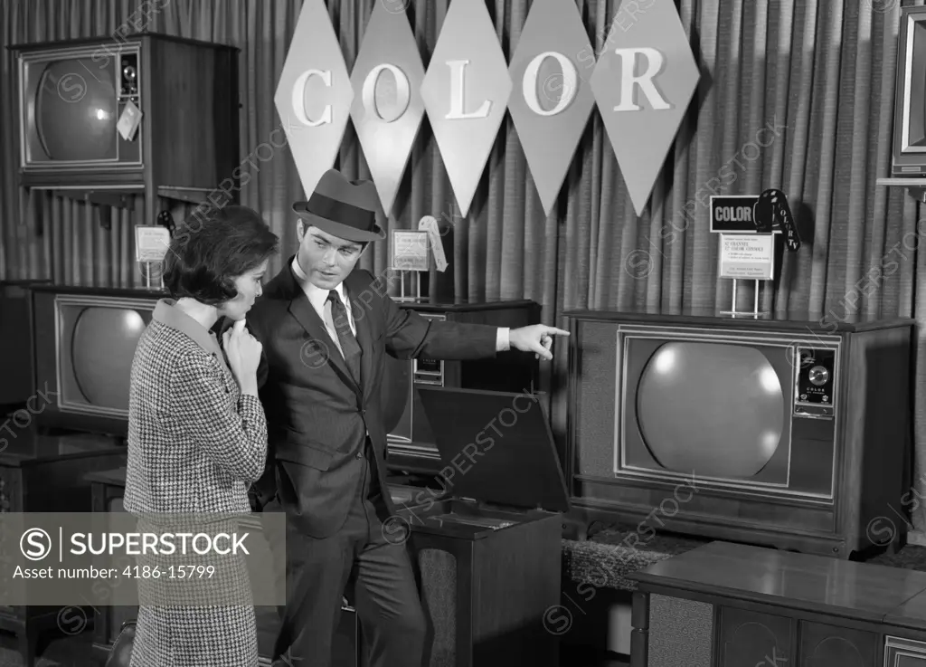 1960S Couple Shopping For Color Tv'S