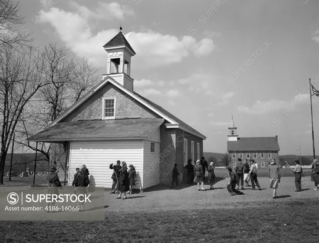 1940S 1950S Elementary School Children At Recess At Rural One Room Schoolhouse