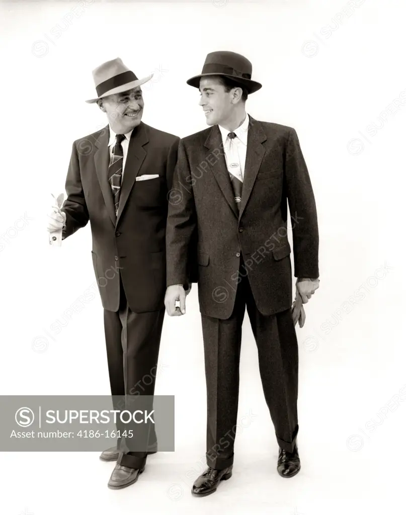 1950S Two Men Salesman Businessman Business Suit Tie Hat Smiling Walking Talking Side By Side