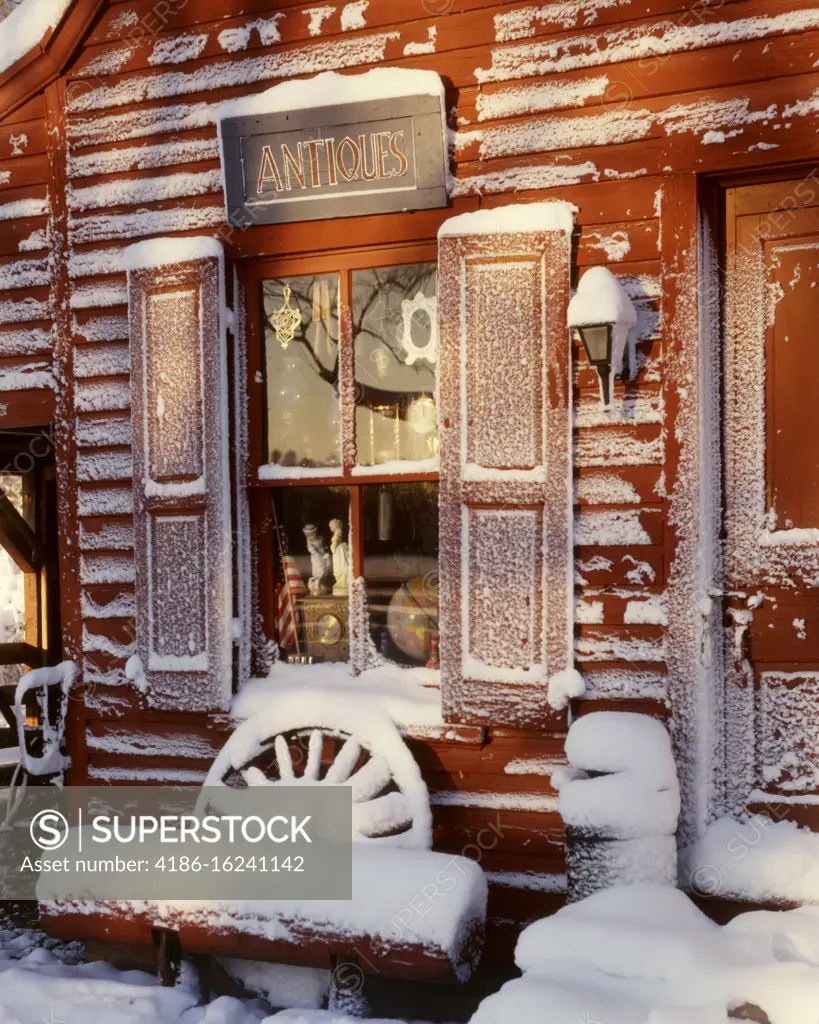 1980s SNOW COVERED ANTIQUE SHOP IN RED CLAPBOARD BUILDNG