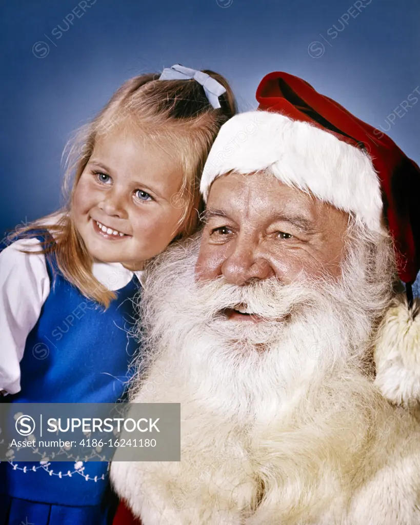 1960s PORTRAIT OF SANTA CLAUS AND LITTLE BLUE-EYED BLOND GIRL BOTH SMILING