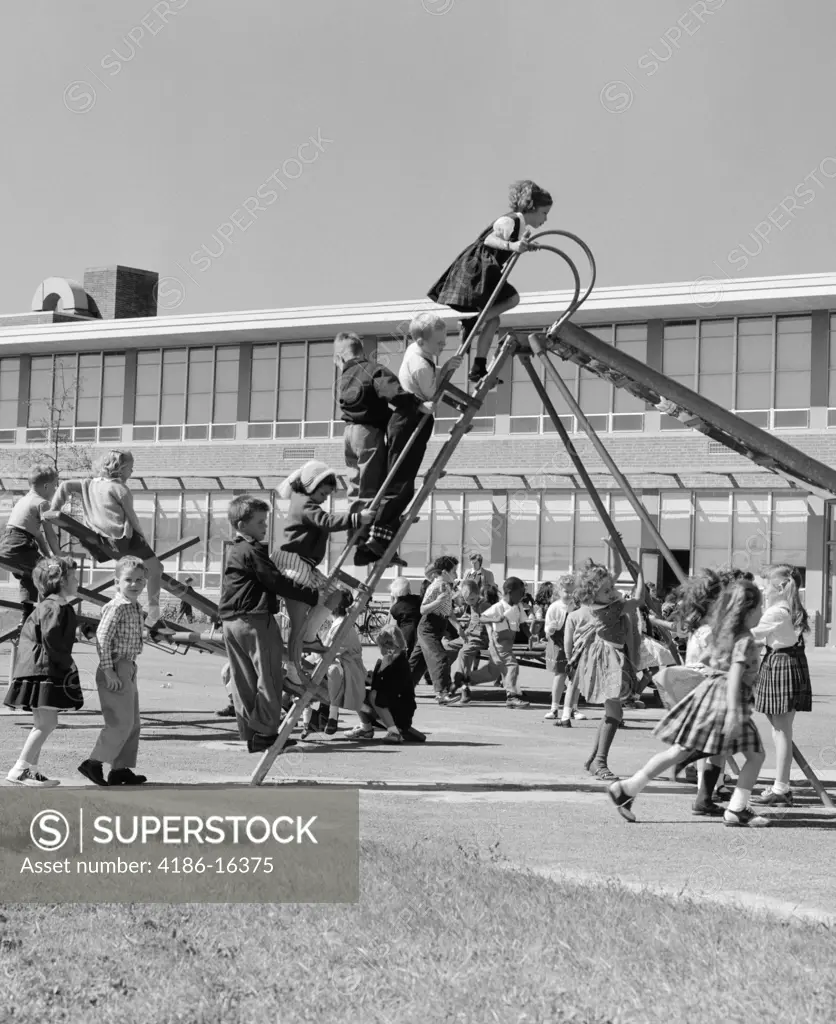 1950S Elementary School Playground At Recess With Line Of Children Climbing Ladder Of Slide