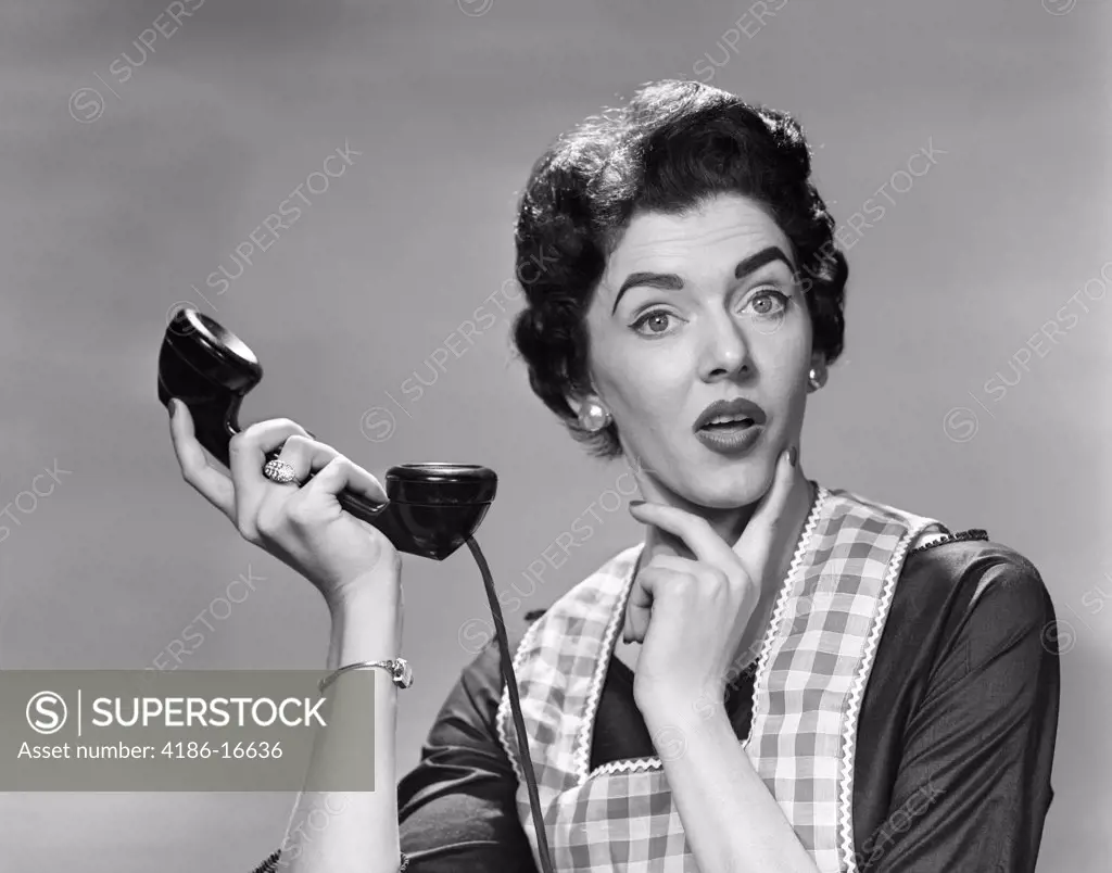 1950S Confused Woman Housewife Holding Up Telephone Receiver Facial ...