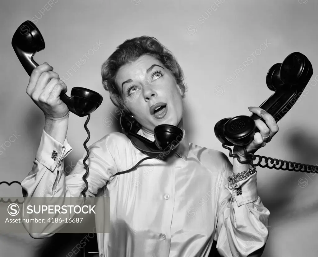 1950S Harried Woman Holding Four Black Telephones Talking On One