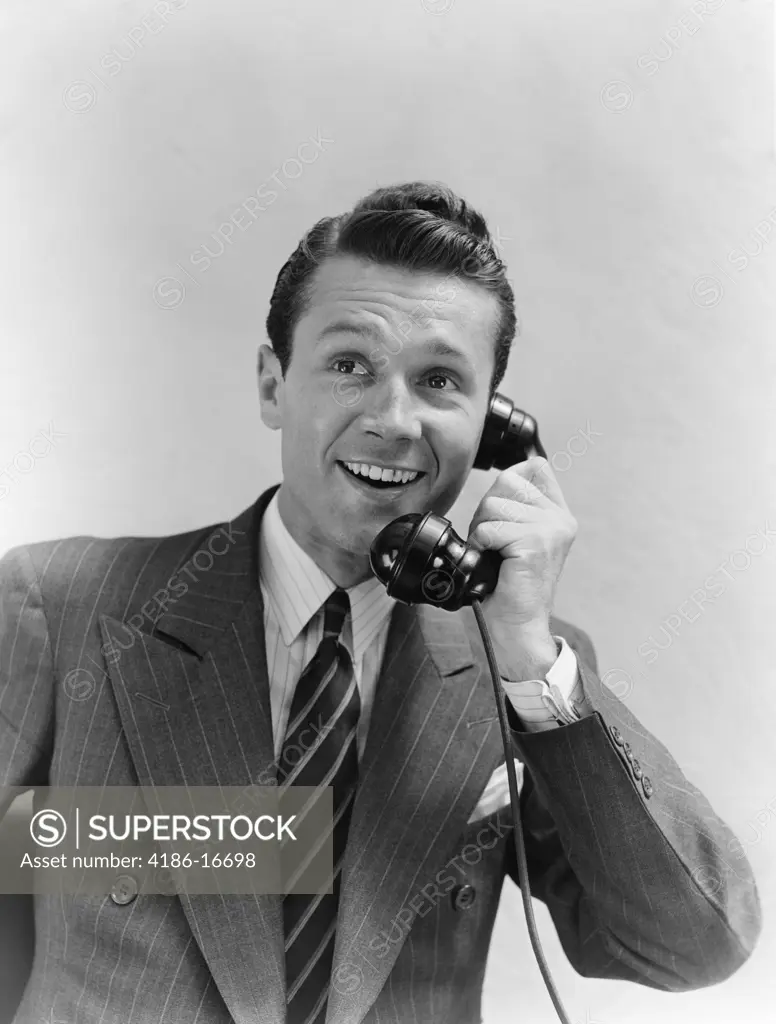 1930S Man In Suit Talking On Telephone