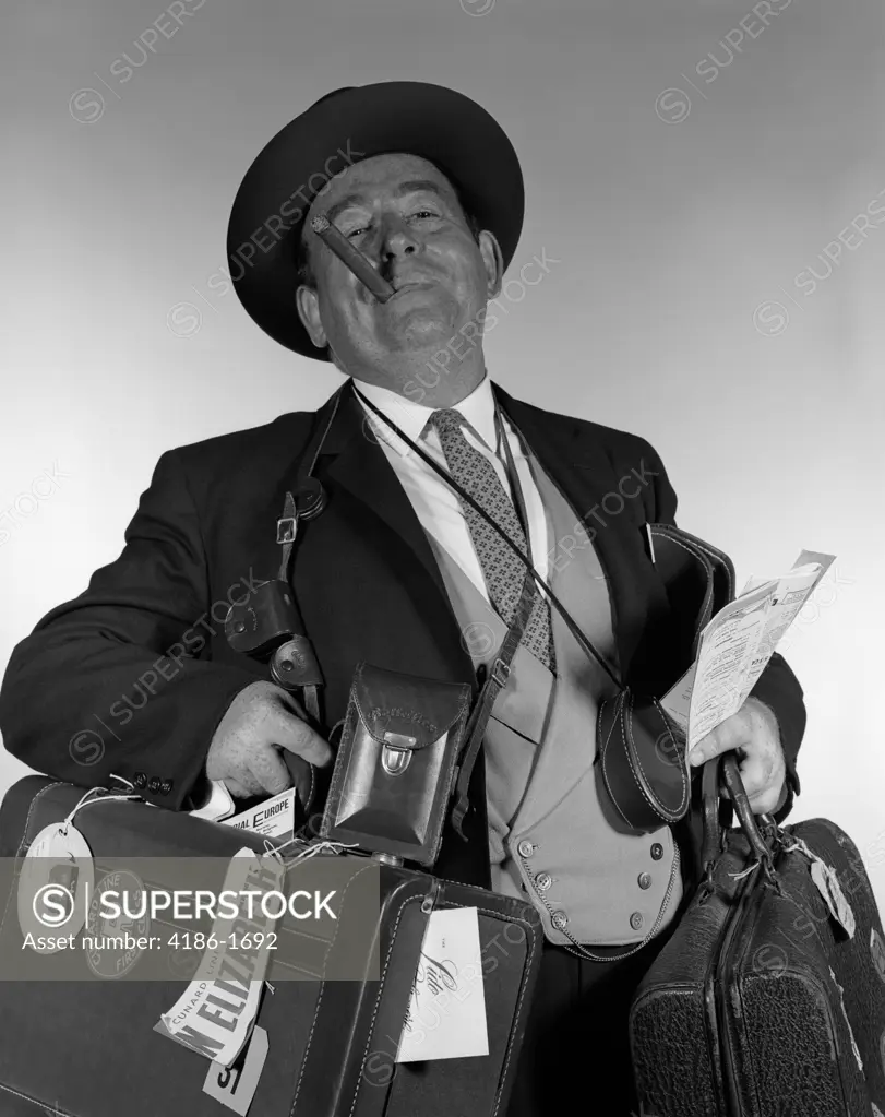 1950S Head-On Portrait Of Cigar Smoking Tourist Carrying Lots Of Luggage