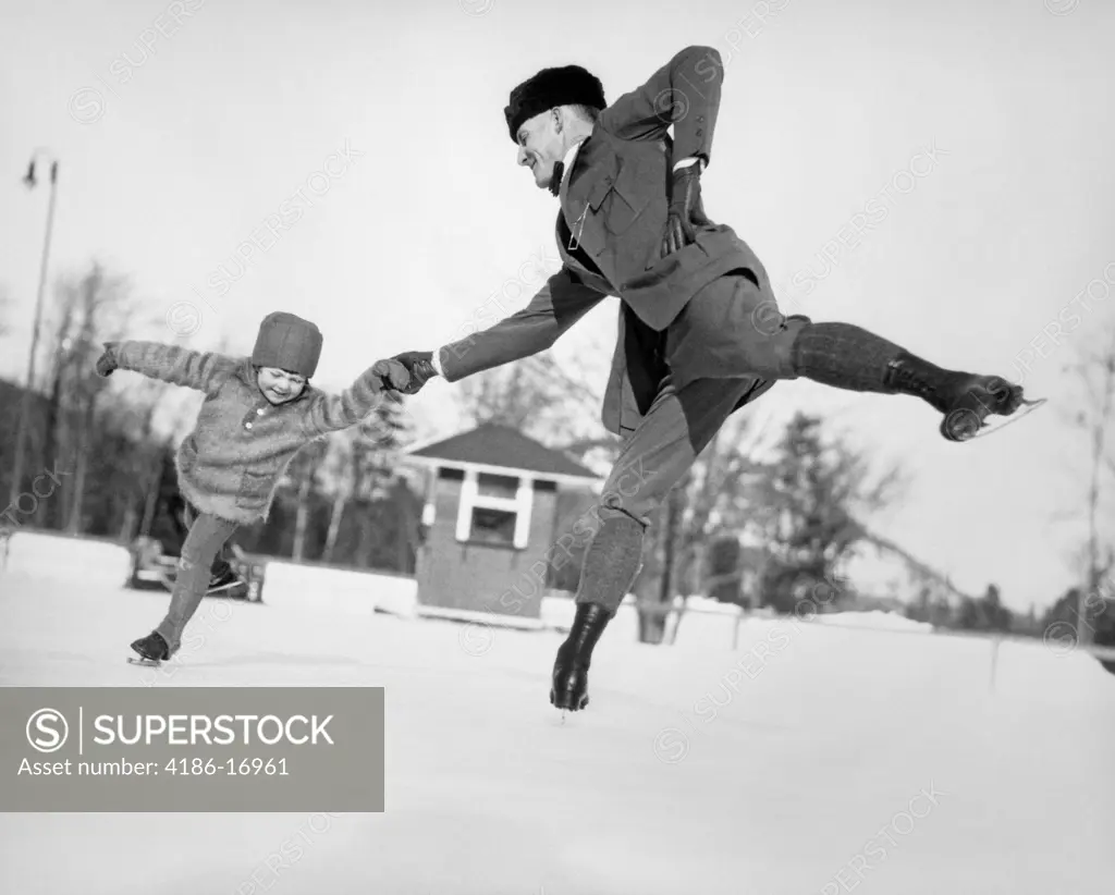 1920S Man Father And Little Girl Daughter Ice Skating Outdoors In Winter