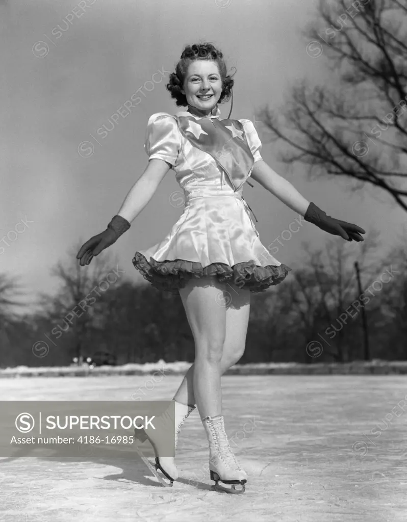 1940S Smiling Woman Figure Skater Performer On Ice Wearing Dress And Gloves