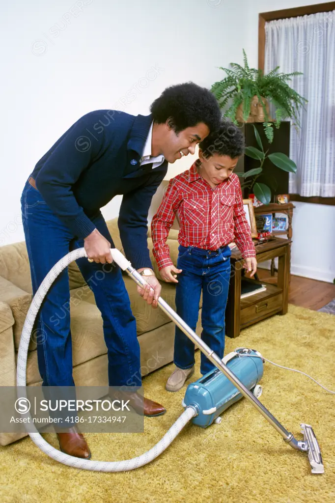 1980s FATHER AND SON VACUUM CLEANING GOLD SHAG CARPET 