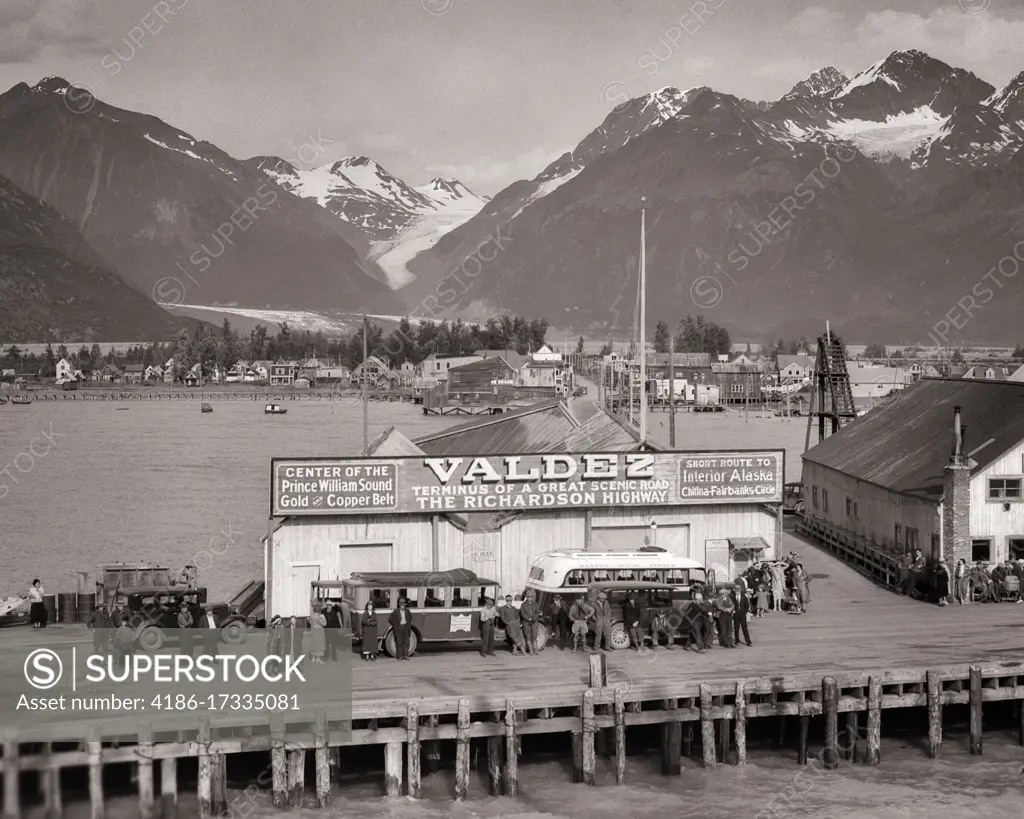 1930s 1940s GROUP OF PEOPLE AT BUS DEPOT ON PIER VALDEZ ALASKA TERMNUS OF THE RICHARDSON HIGHWAY WHICH RUNS TO FAIRBANKS