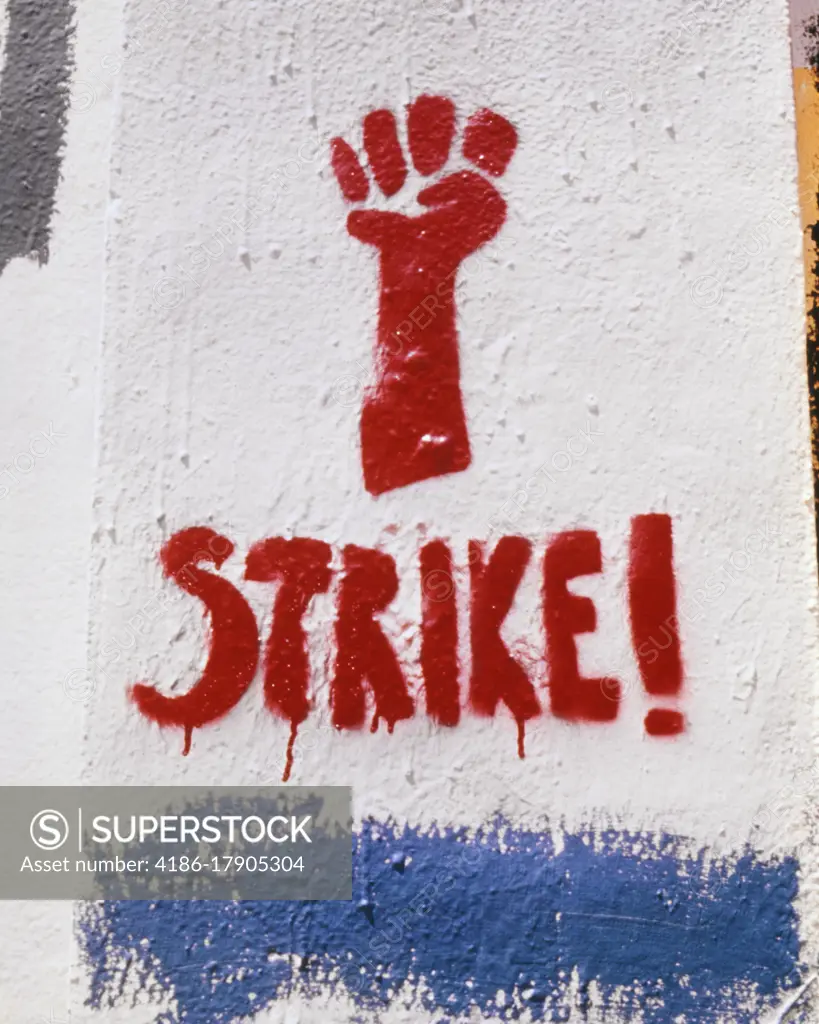 1970s RED FIST STRIKE PROTEST SIGN STENCILED GRAFFITI PAINTED ON WALL