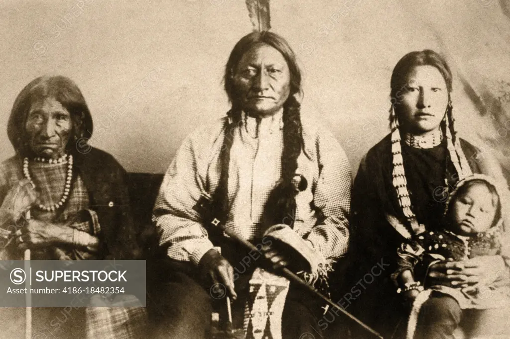 1880s 1881 LAKOTA CHIEF SITTING BULL AND FAMILY PHOTO AT FORT RANDALL WITH MOTHER DAUGHTER AND BABY GRANDSON LOOKING AT CAMERA