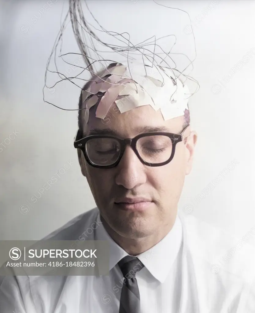 1960s PORTRAIT OF MAN CHARACTER WITH WIRES TAPED TO BALD HEAD