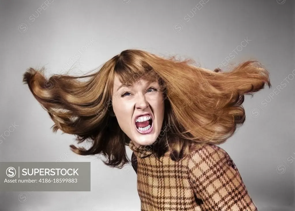 1960s ANGRY WOMAN LONG RED HAIR FLYING LOOKING AT CAMERA YELLING SNARLING GNASHING TEETH