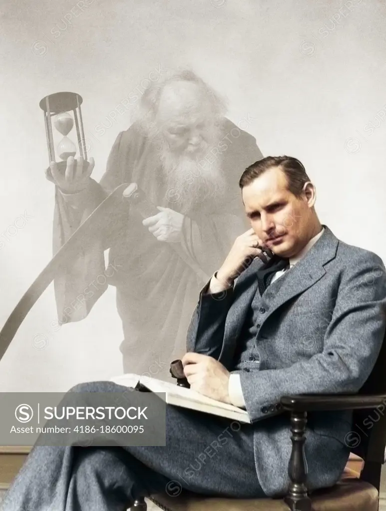 1930s MAN IN SUIT SEATED WITH BOOK IN LAP & PIPE IN HAND WITH PENSIVE LOOK WITH GRIM REAPER GHOSTED IN BACKGROUND