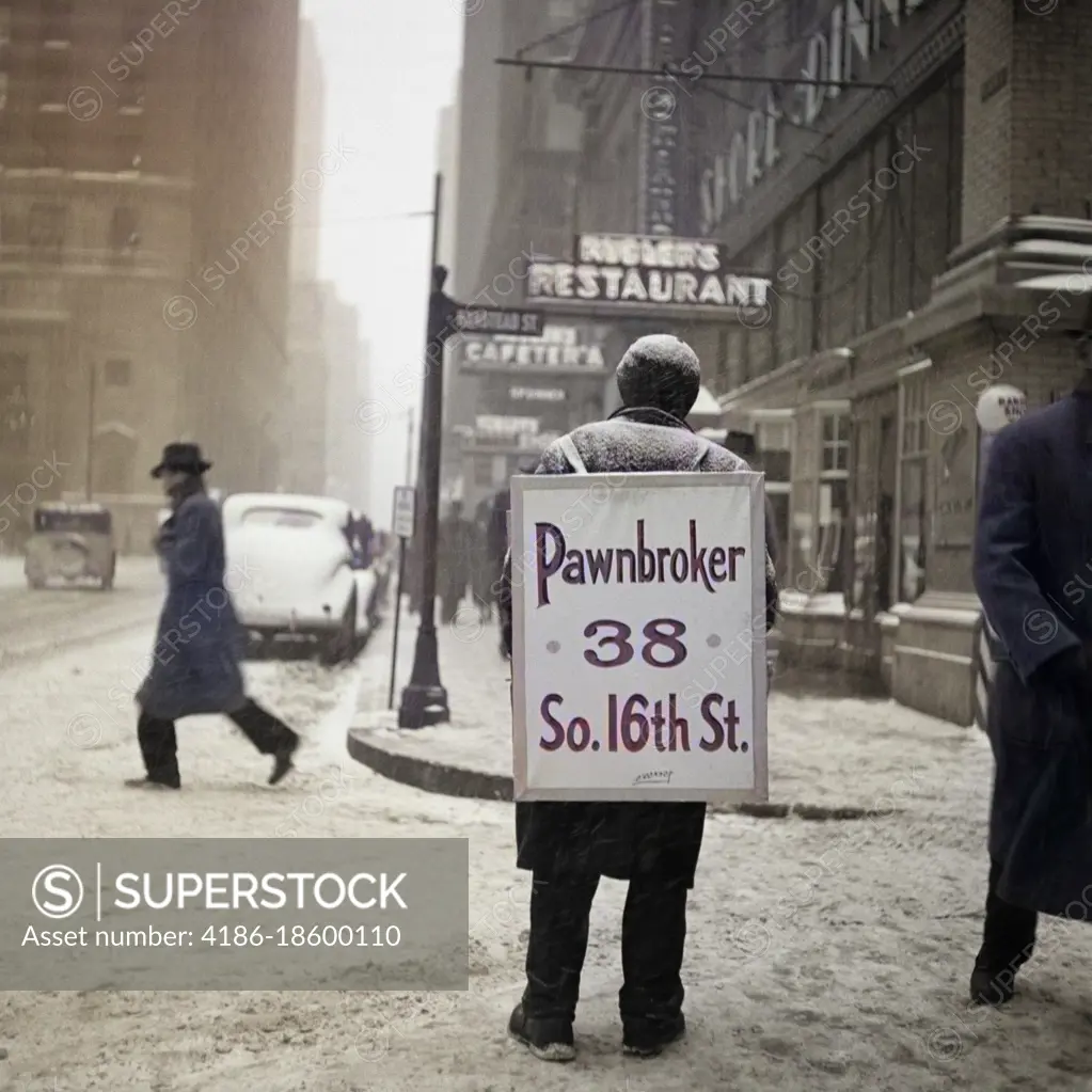 1930s WINTER STREET SCENE OF MAN WEARING PAWNBROKER SANDWICH BOARD