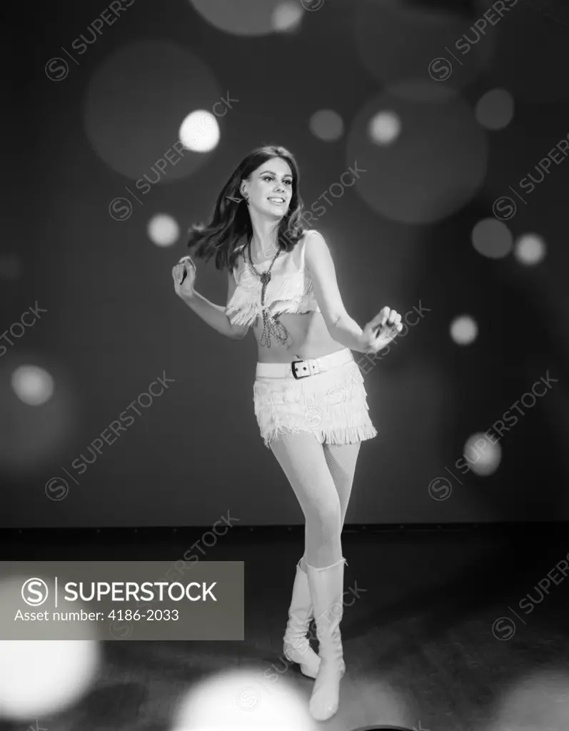 1960S Woman Dancing In White Fringed Halter Top Mini-Dress Skirt And Go-Go Boots