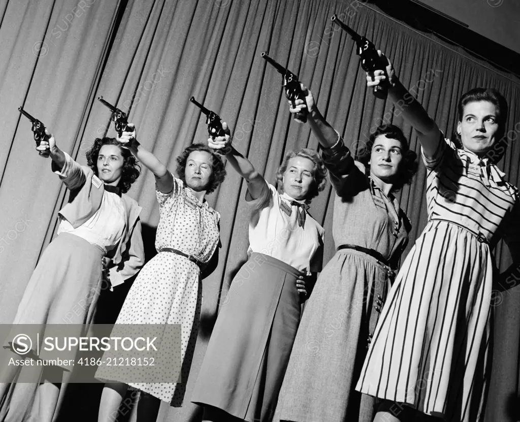 1940s GROUP FIVE WOMEN IN A LINE AIMING PISTOLS