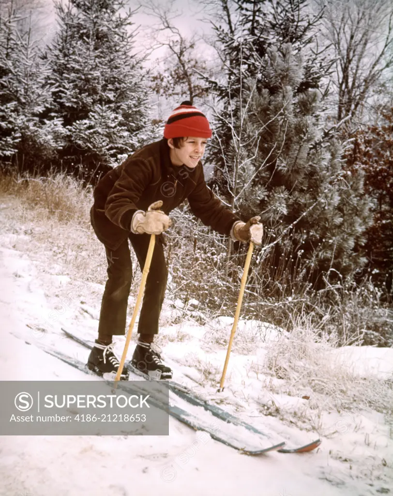 1970s JUVENILE BOY BROWN JACKET RED CAP SKIING SNOW SKIS