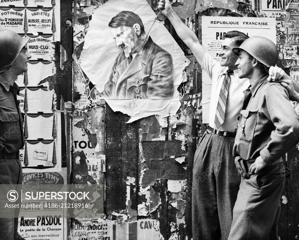 1940s CIVILIAN MAN SYMBOLICALLY HANGING ADOLF HITLER AS TWO YANK ...