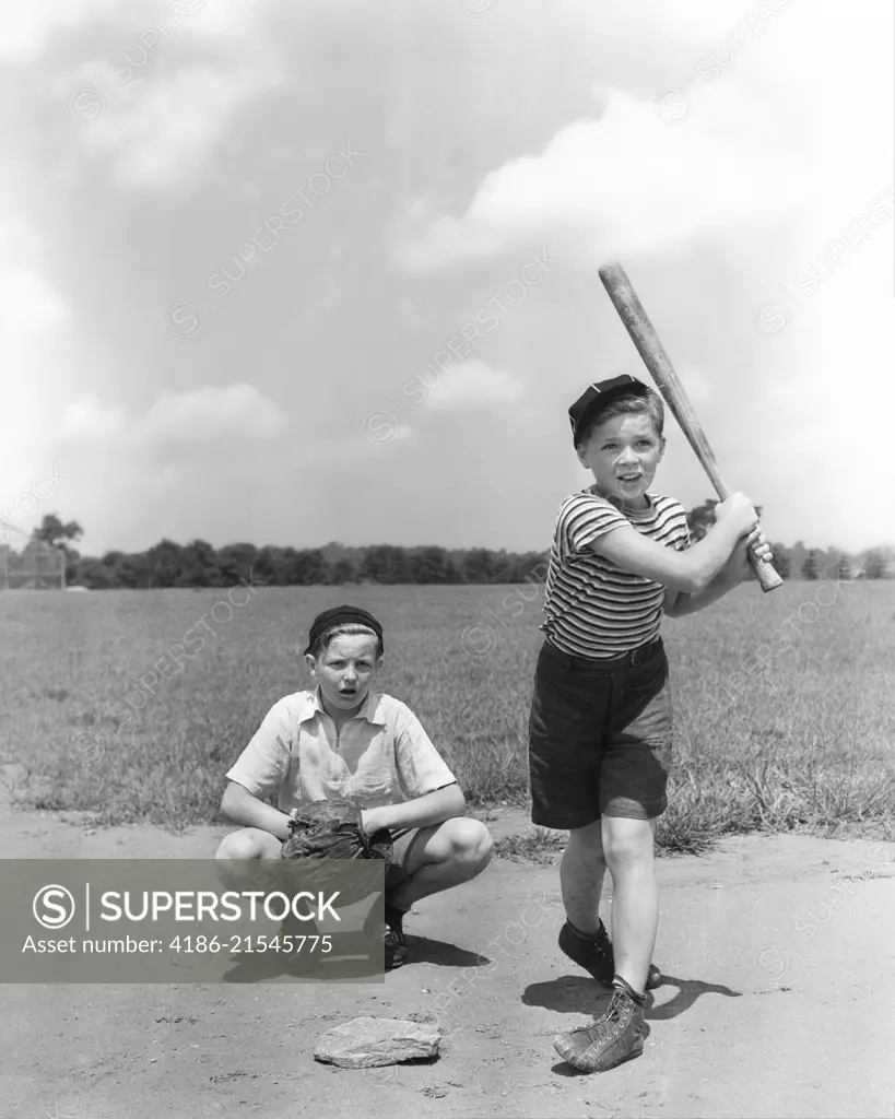 1930s TWO BOYS BATTER AND CATCHER PLAYING BASEBALL