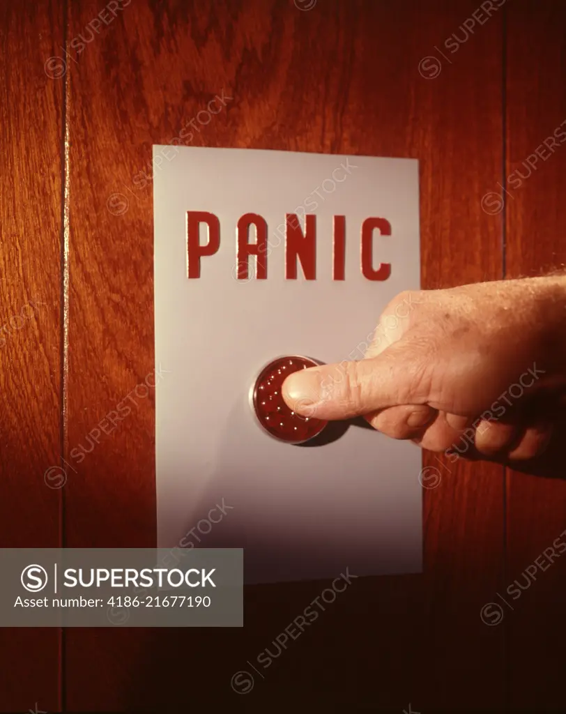 1960s MALE HAND PUSHING PANIC BUTTON