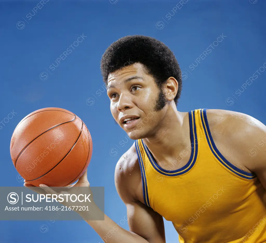 1960s 1970s AFRICAN AMERICAN MAN HOLDING BASKETBALL 