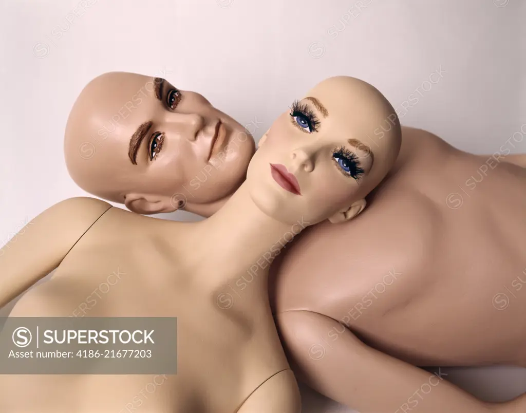 1960s MANNEQUIN DUMMY MAN WOMAN LYING HEAD TO HEAD BALD NAKED WOODEN UNEMOTIONAL STIFF 