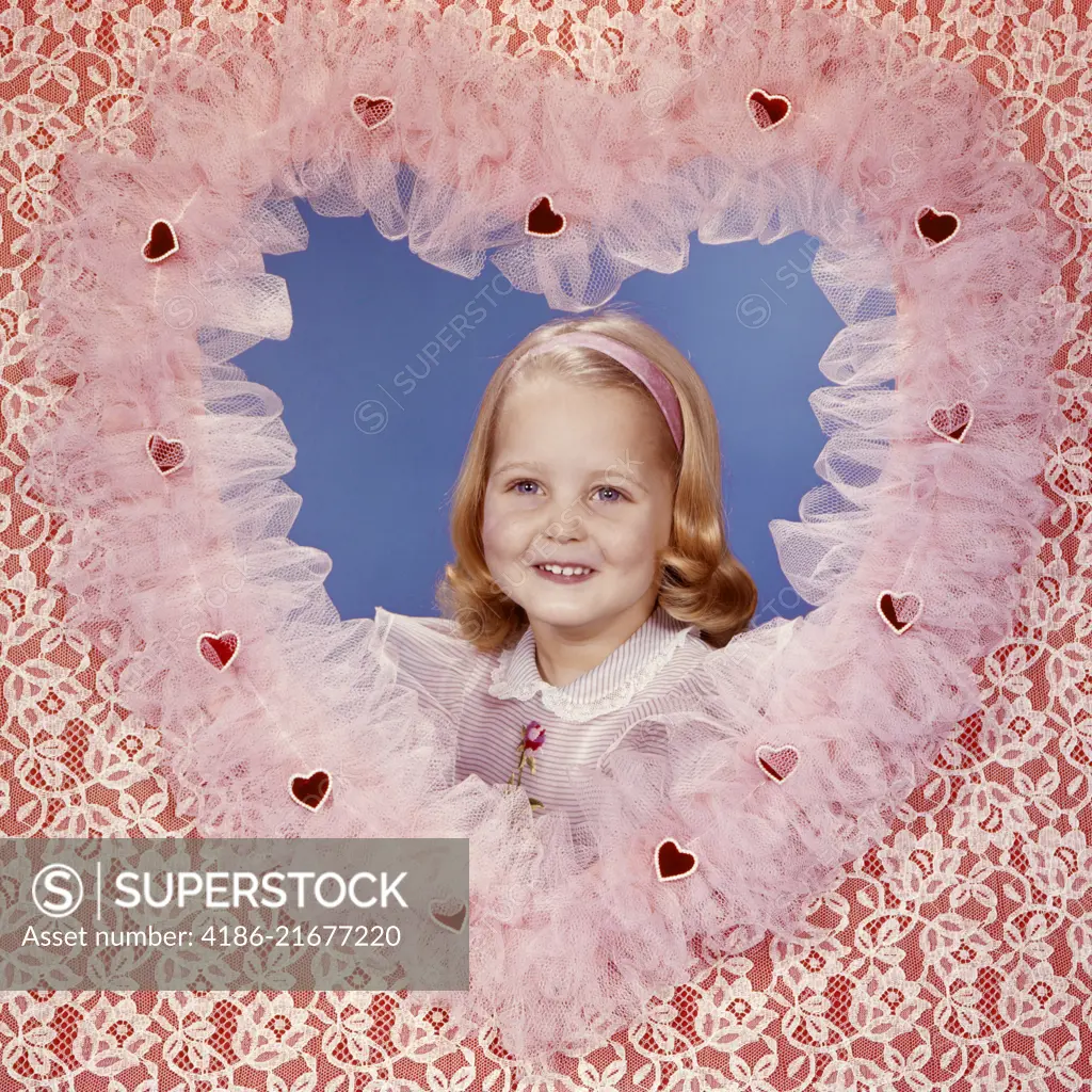 1950s 1960s SMILING BLOND GIRL POSING INSIDE A LACE VALENTINE HEART