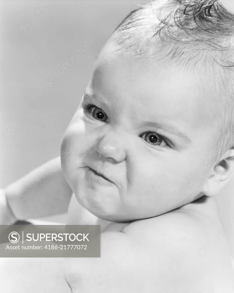 1950s 1960s BABY GIRL LOOKING ANGRY MAD MEAN - SuperStock