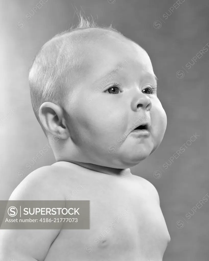 1950s BABY IN PROFILE WITH POMPOUS FACIAL EXPRESSION