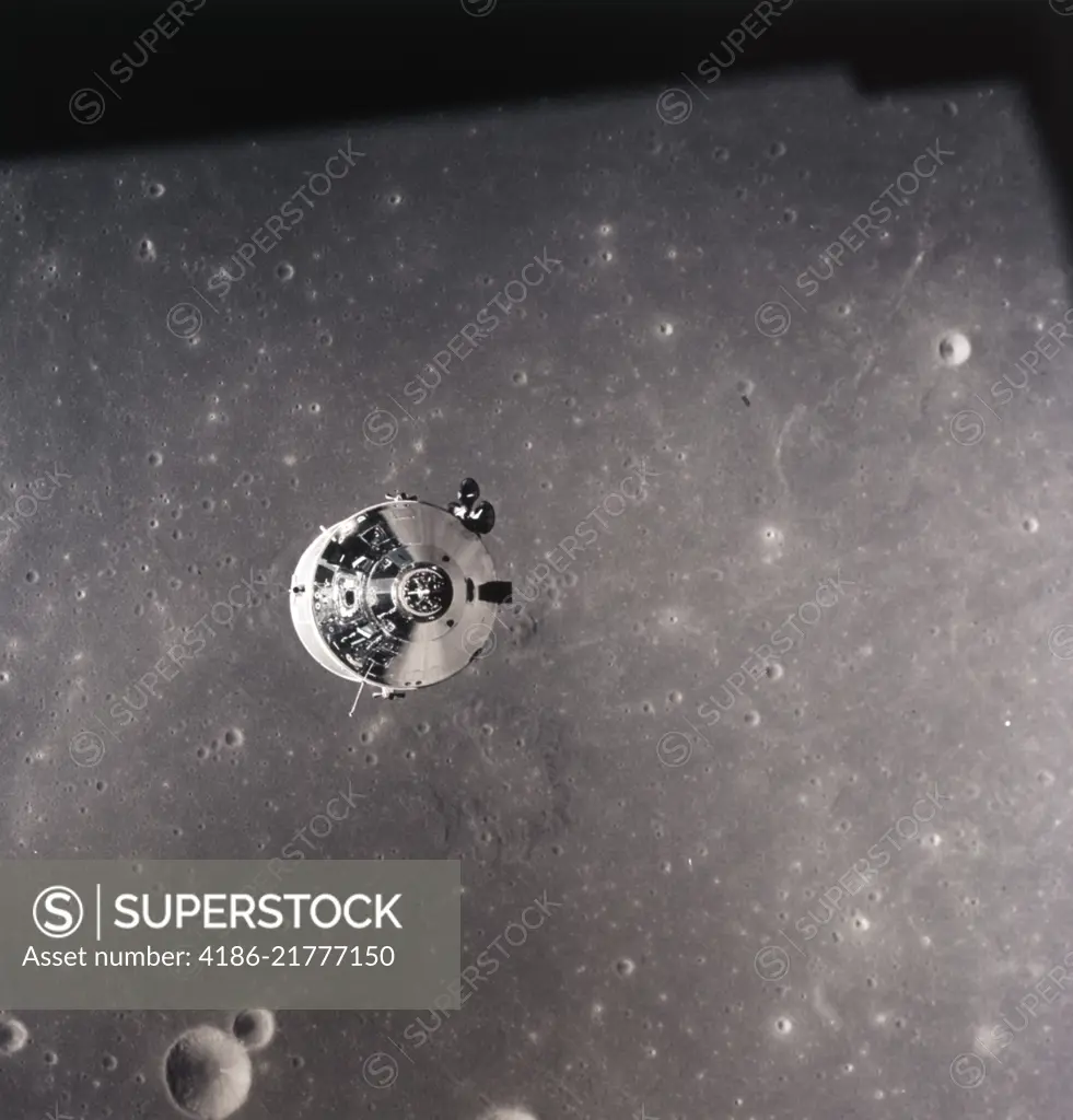 1960s JULY 1969 APOLLO 11 COMMAND MODULE OVER THE SURFACE OF THE MOON