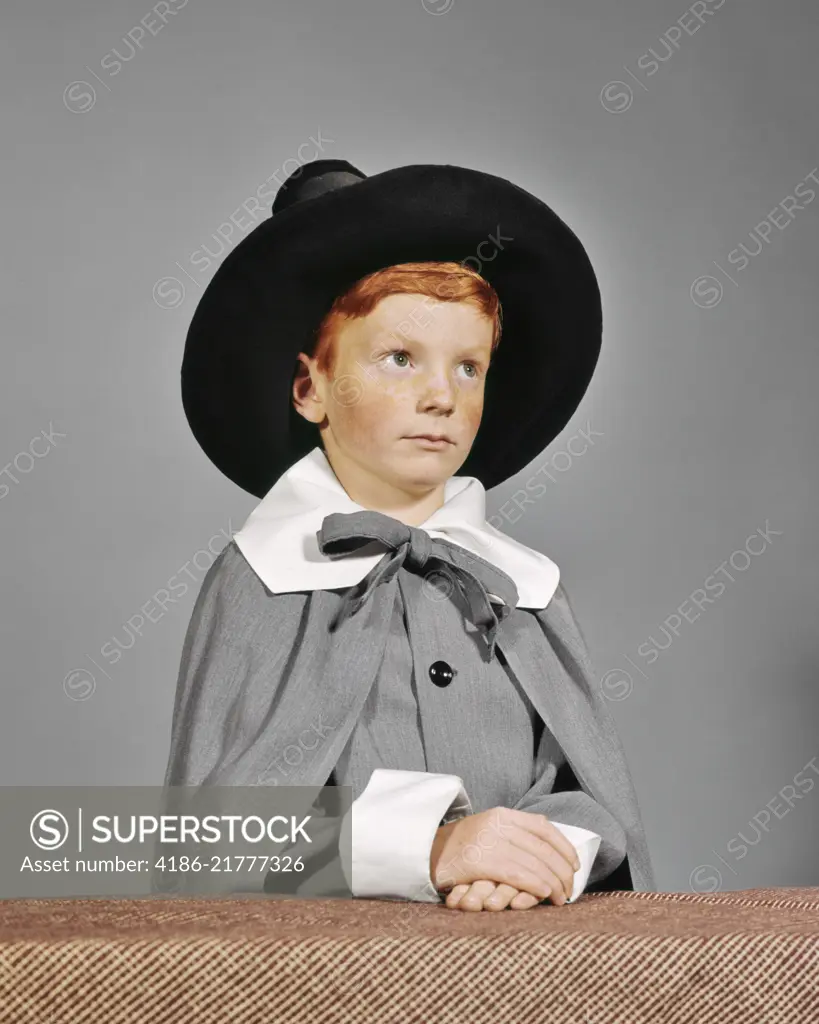 1960s SERIOUS BOY DRESSED IN PILGRIM CLOTHES COSTUME FOR THANKSGIVING SCHOOL PLAY