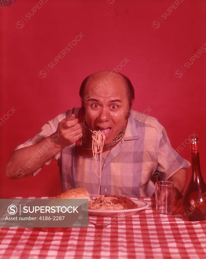 1960S Bald Man Eating Spaghetti