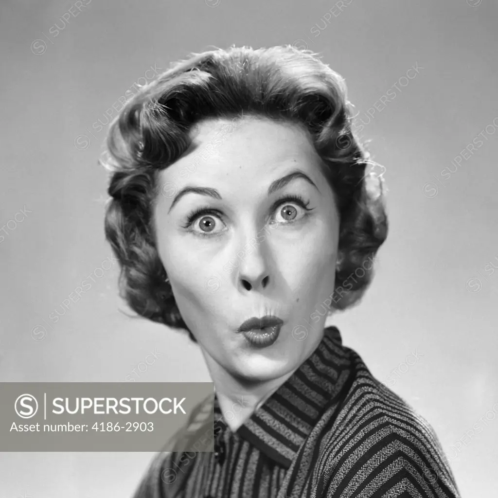 1950S Woman Making Funny Face Eyes Wide Lips Pursed As In A Kiss Or A Whistle