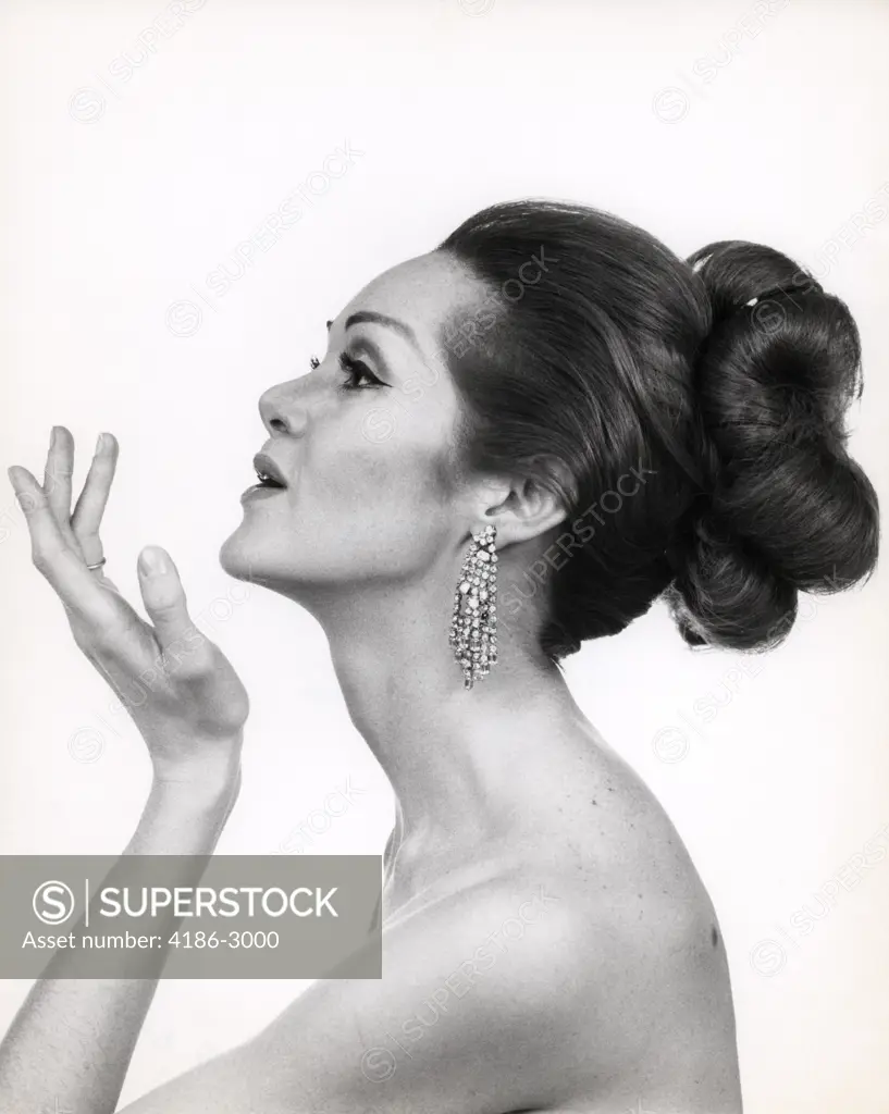 1970S Profile Portrait Of Glamorous Woman With Bare Shoulders & High Fashion Makeup And Hairstyle