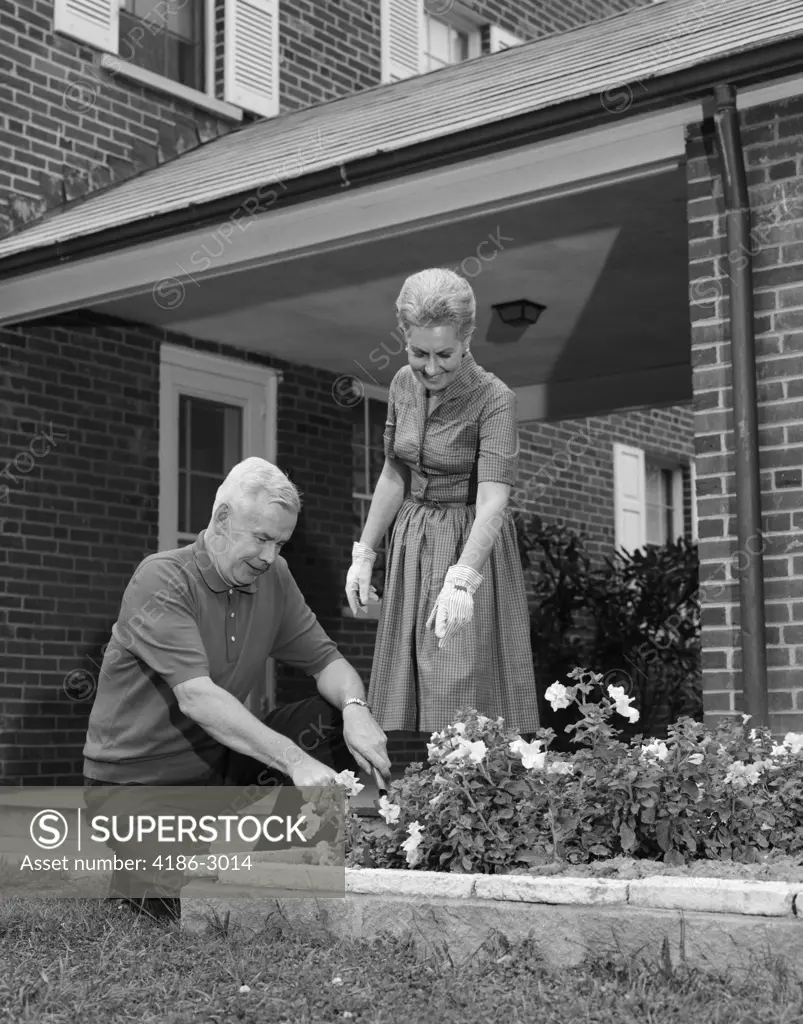 1960S Man Woman Gardening Flower Garden