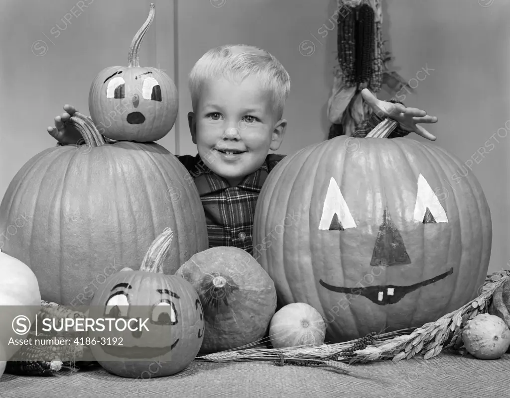 1960S Smiling Blond Boy Surrounded By Pumpkin Patch Jack-O'-Lantern