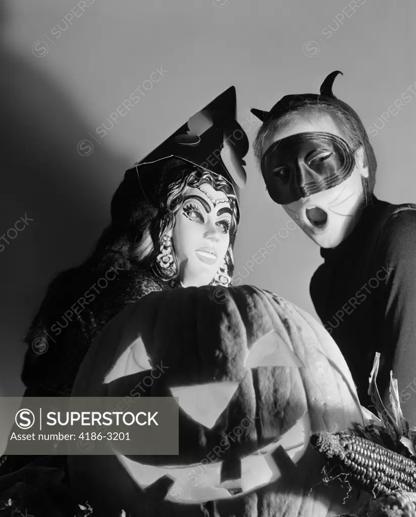 1950S Two Children In Halloween Costume Behind A Carved Pumpkin Jack-O-Lantern