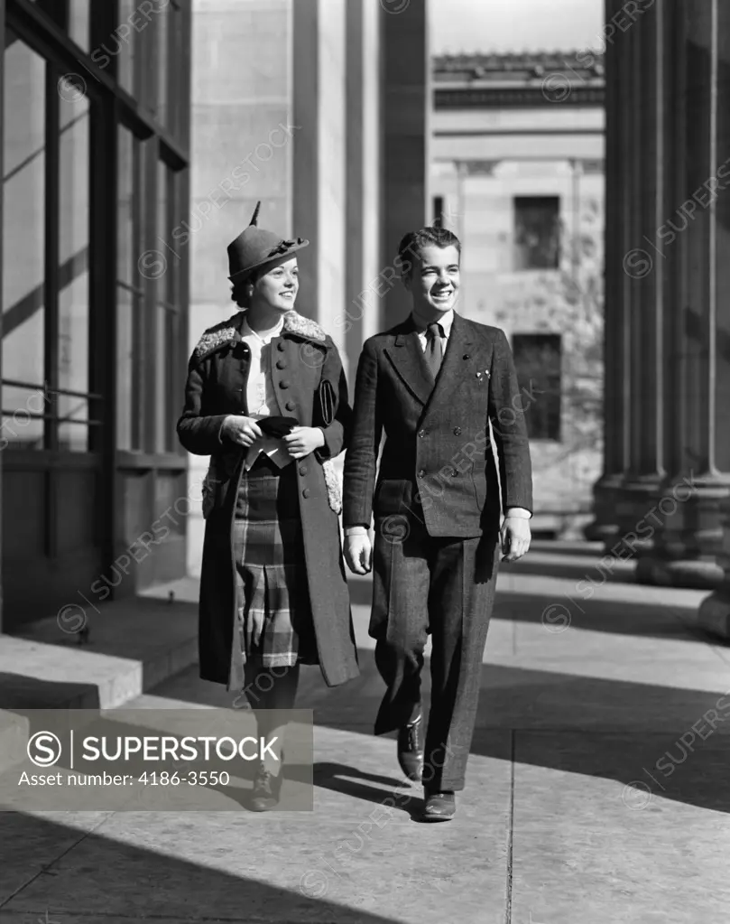 1940S Young Teenage Couple Boy Girl Walking Column Arcade Wearing Business Street Clothes