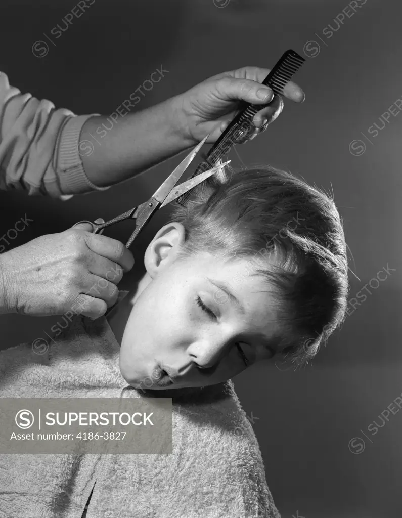 1950S Boy Making Face As Parent Cuts His Hair Barber Comb Scissors Hands Amateur Haircut