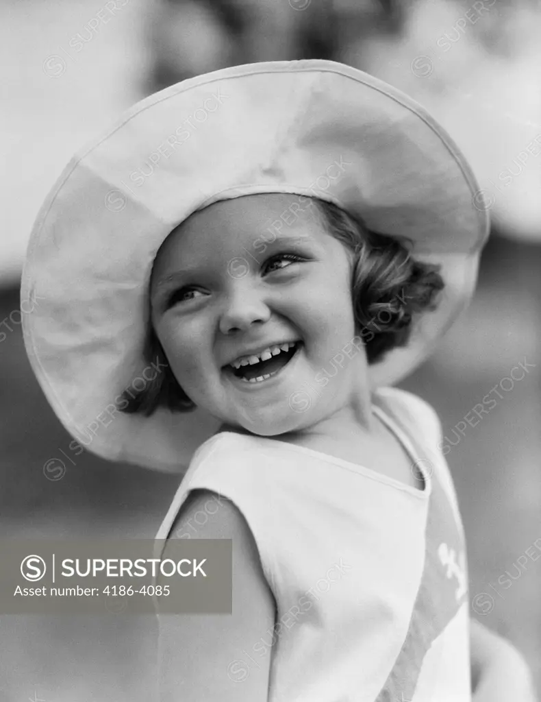 1930S Girl Head Shot Wearing Wide Brimmed Hat Smiling Outdoor