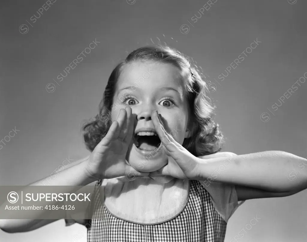 1950S Little Girl Shouting Yelling Hands Cupped Around Wide Open Mouth