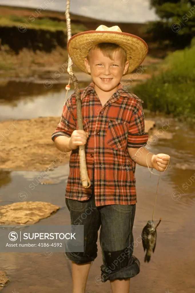 1950S Smiling Boy Straw Hat Holding Fishing Pole Wearing Plaid Shirt Blue  Jeans - SuperStock