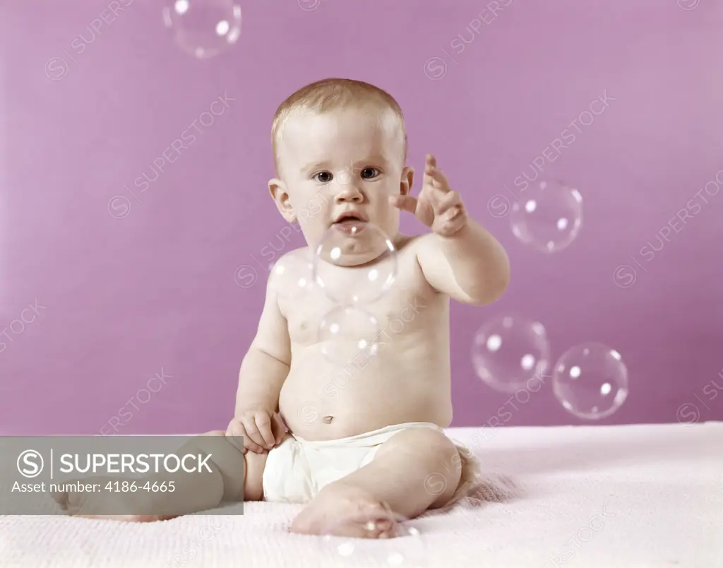 1970S Baby Trying To Catch Soap Bubbles