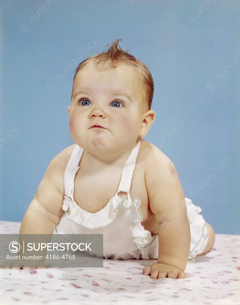 1960S Baby Making Funny Face Pushed Up On Arms Crawling Forward