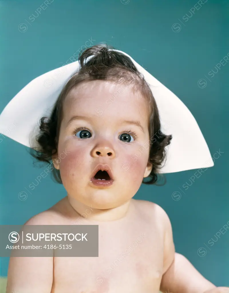 1960S Surprised Baby Facial Expression Wearing A Nurse Cap