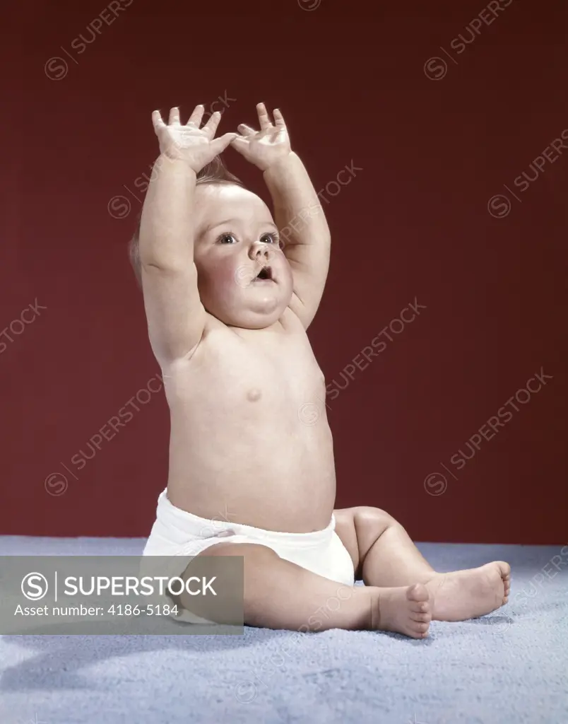 1960S Baby Wearing Cloth Diaper Sitting Arms Raised Over Head